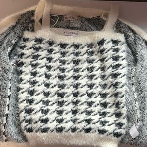 white and black sweater with a matching tank top connected